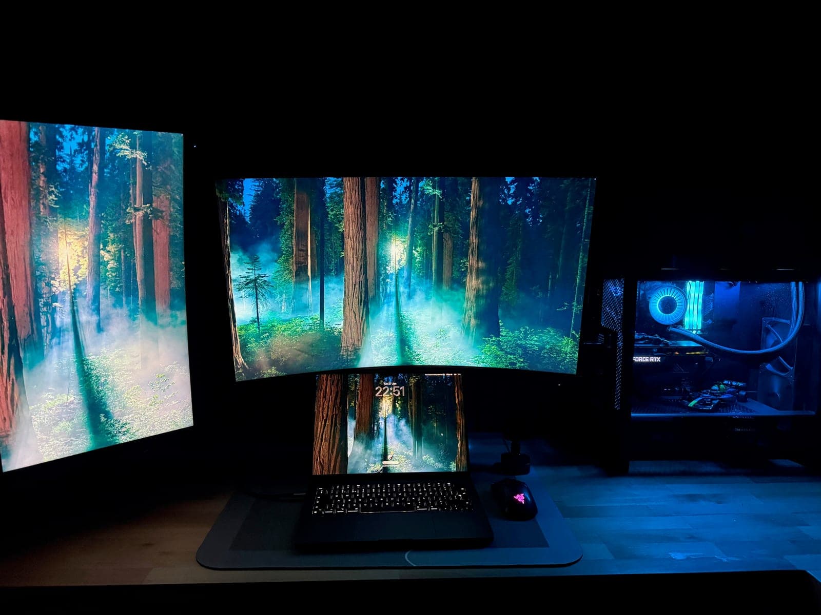 Andrei's desk setup: dual monitors, MacBook and a custom RTX PC